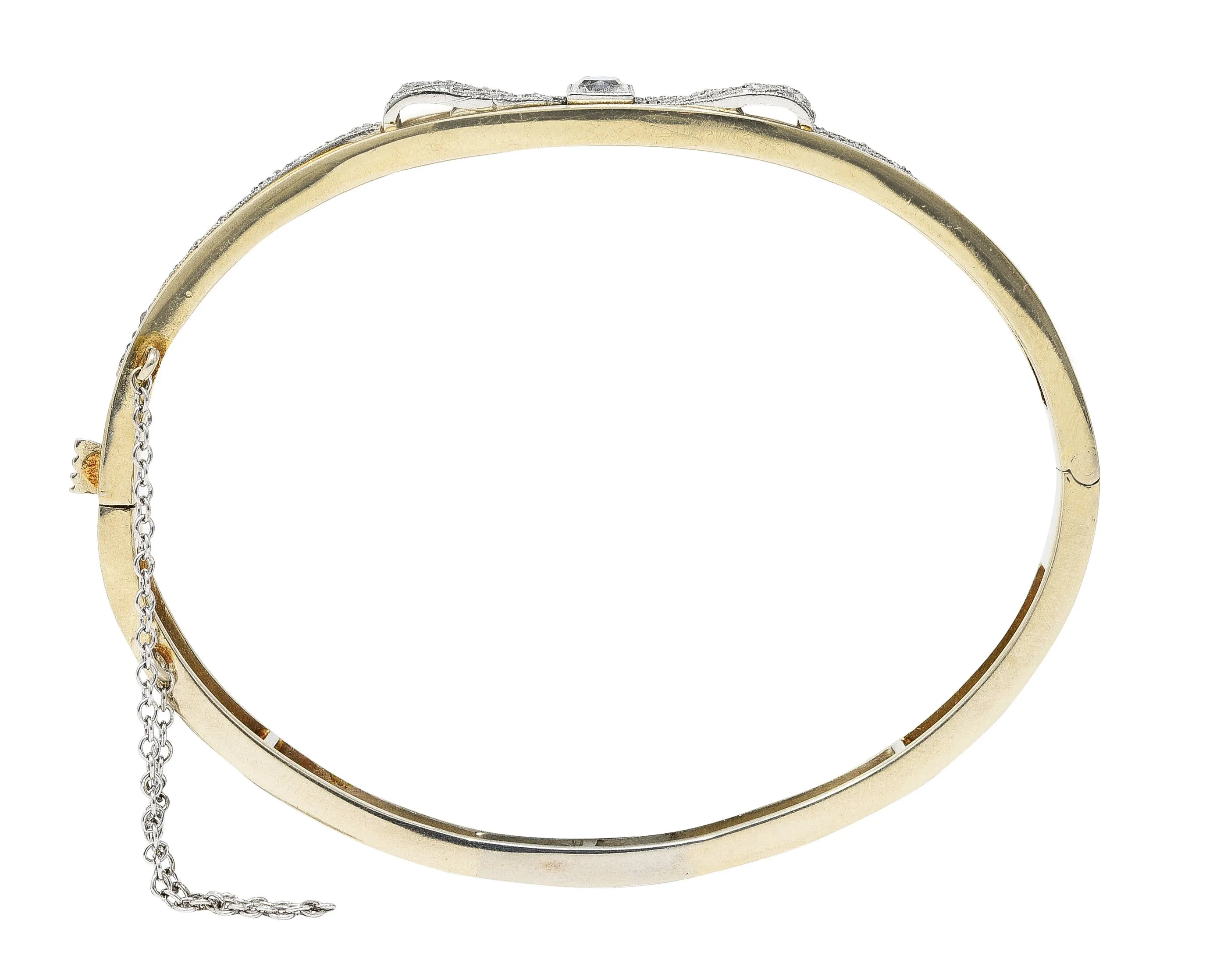 Edwardian 1.04 CTW French Cut Diamond Platinum-Topped 14 Karat Yellow Gold Bow Antique Bangle Bracelet