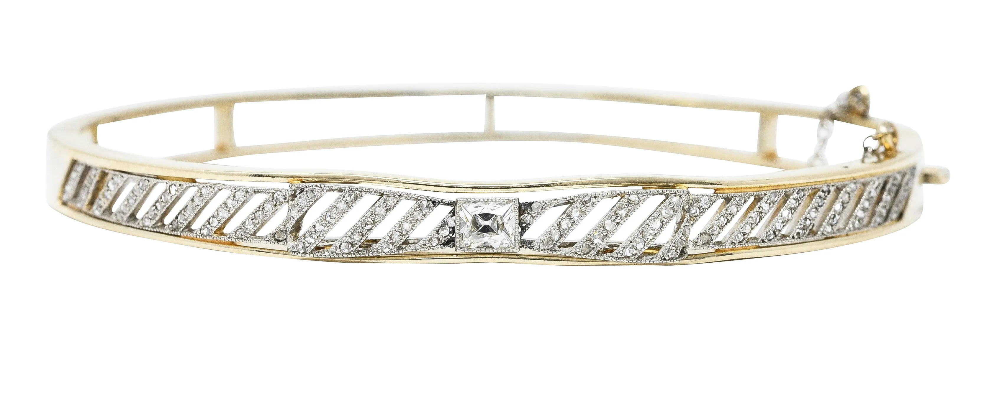 Edwardian 1.04 CTW French Cut Diamond Platinum-Topped 14 Karat Yellow Gold Bow Antique Bangle Bracelet