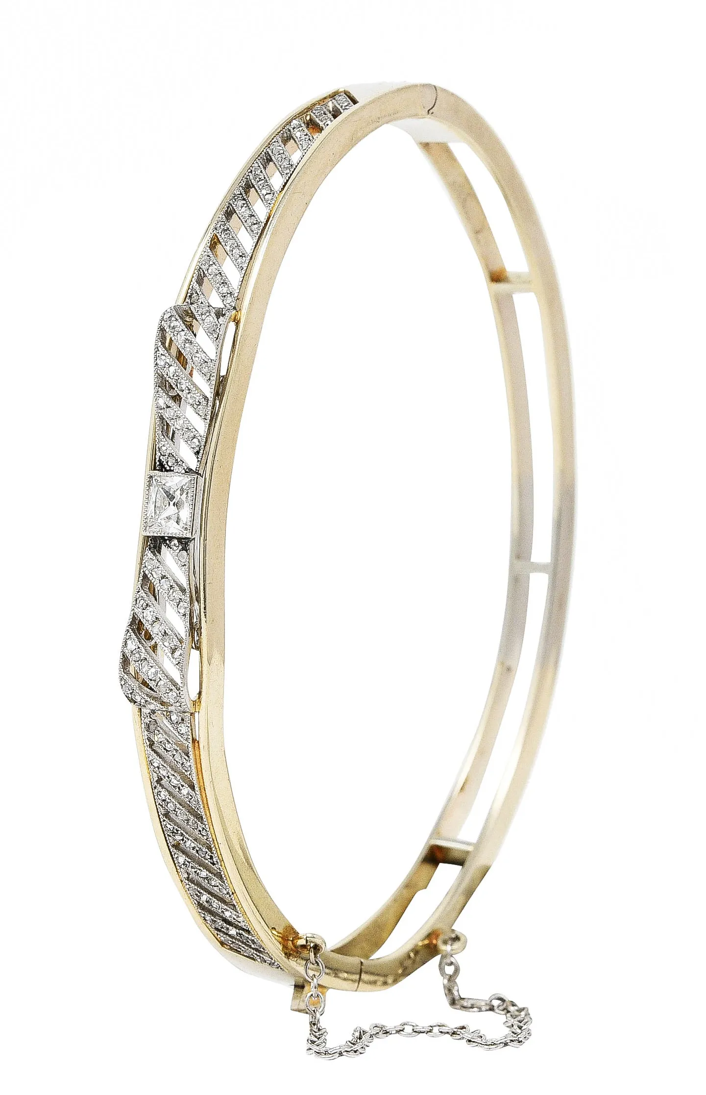 Edwardian 1.04 CTW French Cut Diamond Platinum-Topped 14 Karat Yellow Gold Bow Antique Bangle Bracelet